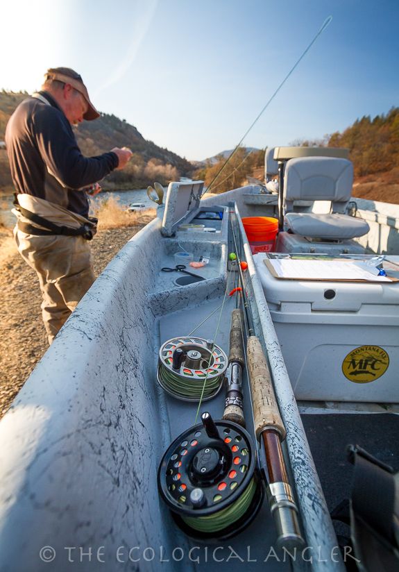 Chris Gearhart ties up a fishing rig before starting a drift down the Klamath River.
