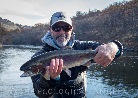 Michael Carl with a steelhead caught on the fly drifting the Klamath River in California.